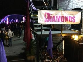 Diamonds banner with stage in background
