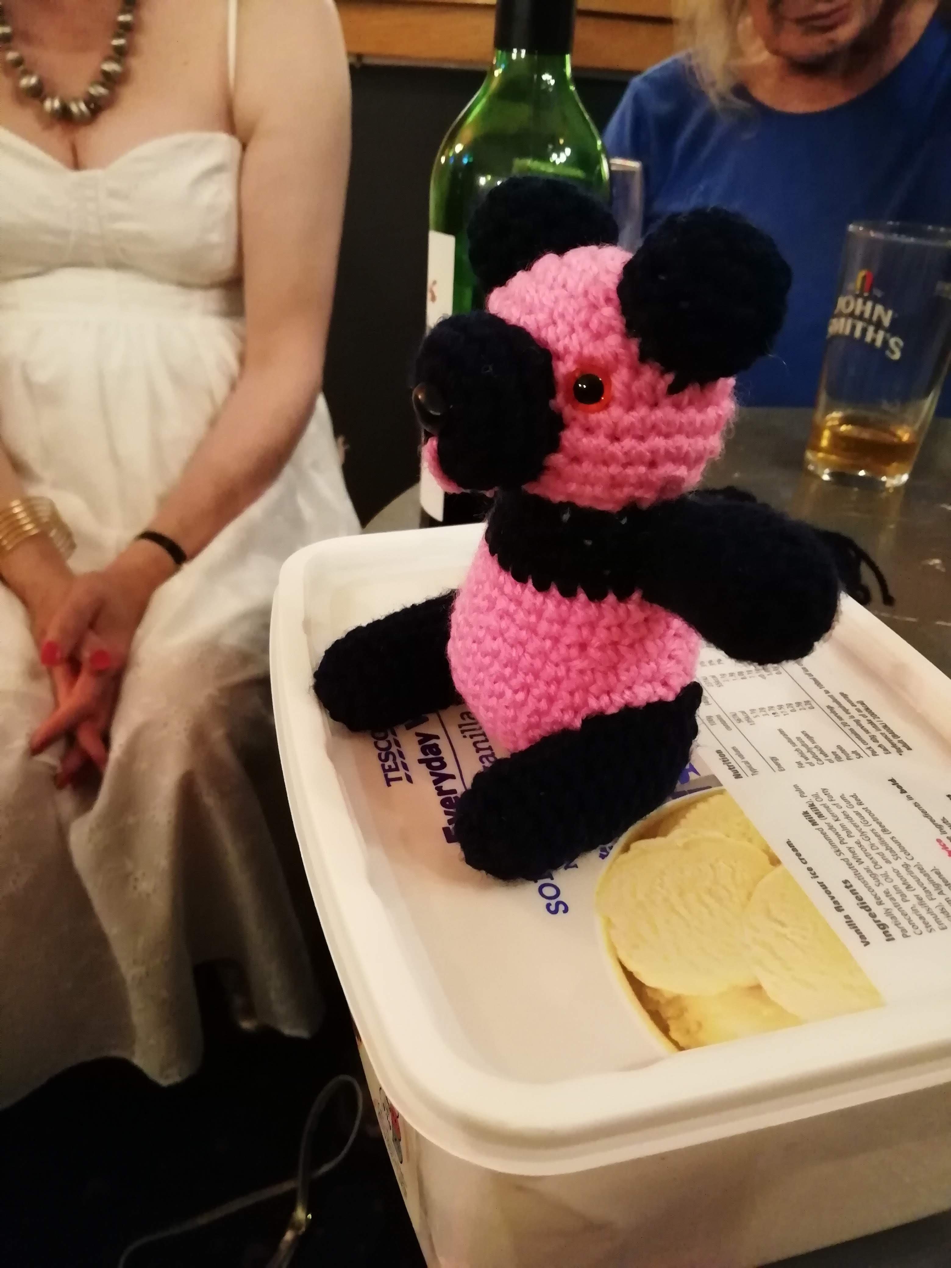 Crocheted panda on a table